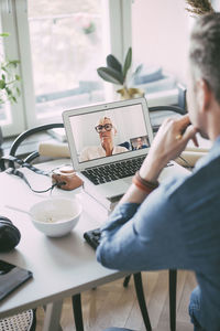 Businesspeople having video conference call working at home