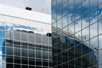 Low angle view of office building against sky