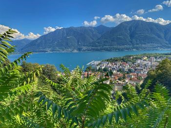 Panoramic shot of city and mountains against sky