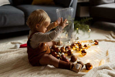 High angle view of girl playing chess on table