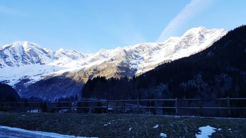 Scenic view of snowcapped mountains against sky