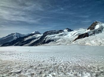 Scenic view of snowcapped mountains against sky