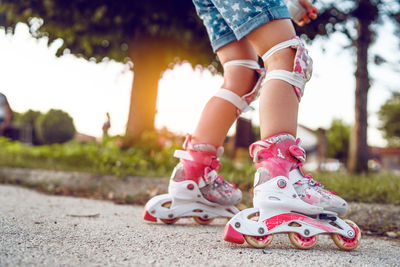 Low section of woman wearing high heels outdoors