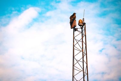 Low angle view of tower against blue sky