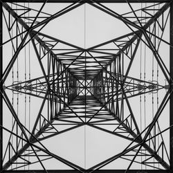 Low angle view of electricity pylon against sky