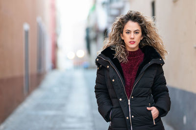 Portrait of woman standing outdoors