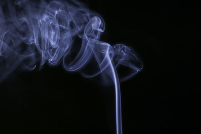 Close-up of smoke against black background