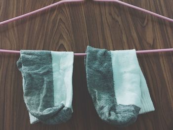 High angle view of clothes hanging on wood