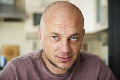 Close-up portrait of mature man at home