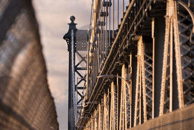 Close-up of metal structure against sky