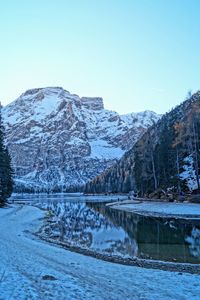 Scenic view of snowcapped mountains against clear sky