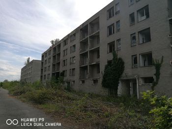 View of residential buildings against sky