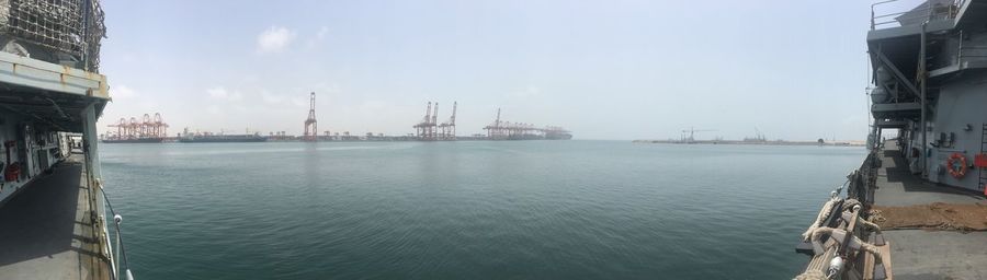 Panoramic view of harbor against sky