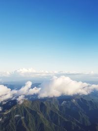 Aerial view of majestic mountains against sky