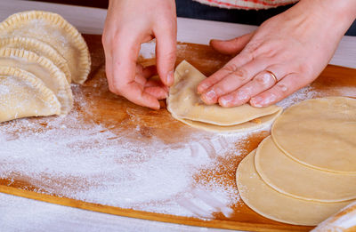 High angle view of people preparing food on table