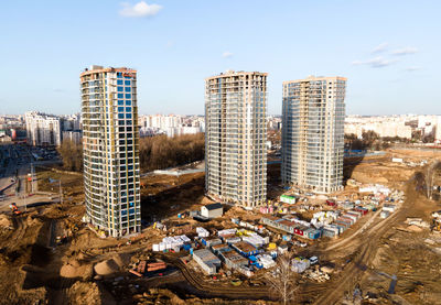 High angle view of buildings in city against sky