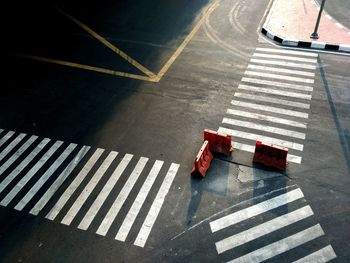 High angle view of barricades at zebra crossing on road