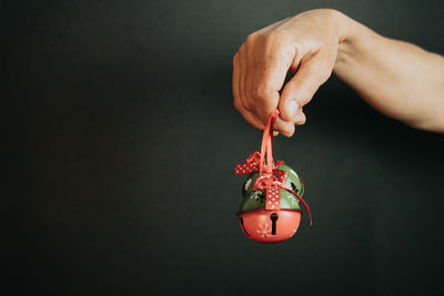 Cropped hand of woman holding bauble