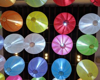 Low angle view of illuminated lanterns hanging at night