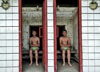 Multiple image of shirtless boy sitting in waiting room