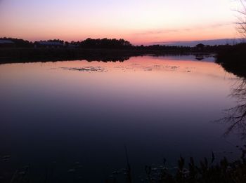 Scenic view of lake at sunset