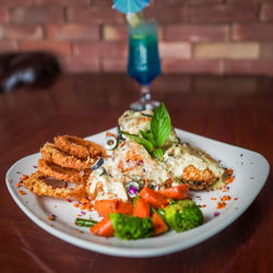 Close-up of food served on table