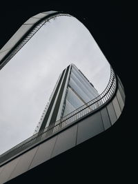 Low angle view of suspension bridge against sky