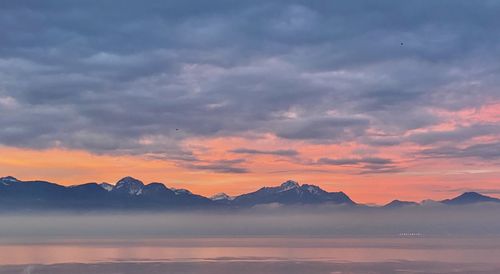 Scenic view of mountains against sky during sunset