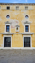 Ancient building with windows and doors in venice, italy, europe