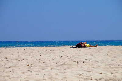 Scenic view of beach against clear sky