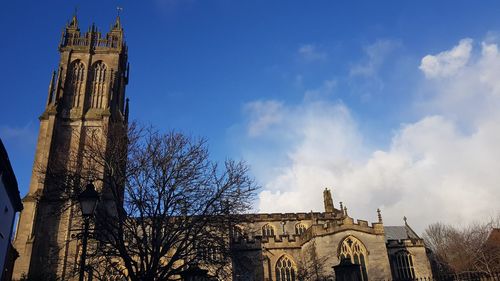 Low angle view of bell tower against sky