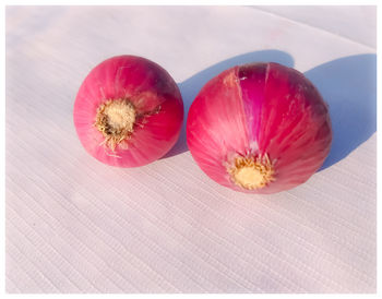 Close-up of pink fruits on table