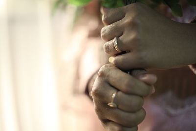 Close-up of man holding hands