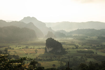 Scenic view of landscape and mountains against sky