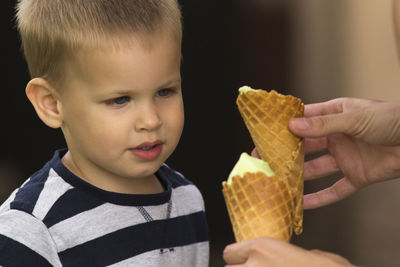 Close-up of boy eating