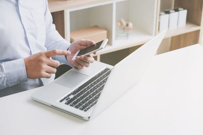 Man using laptop on table