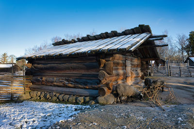 Abandoned building against sky during winter