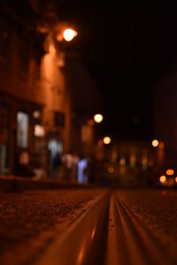 Surface level of illuminated railroad tracks at night