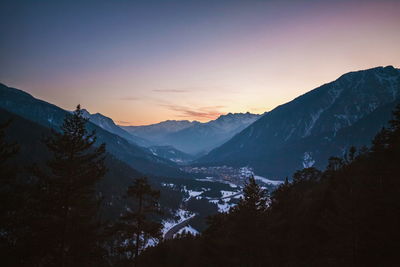 Scenic view of mountains against sky during sunset