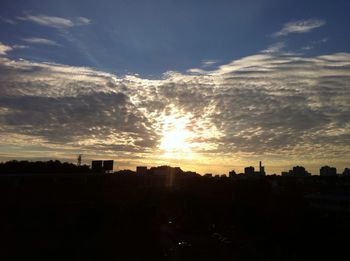 Silhouette of built structure at sunset