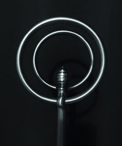 Close-up of electric lamp against black background