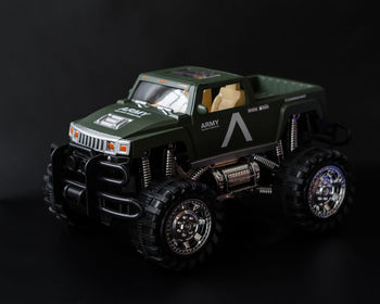 Close-up of toy car against black background