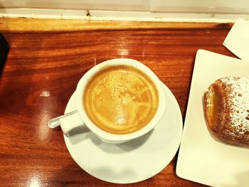 Close-up of cappuccino on table