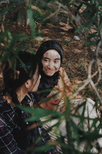 Portrait of a girl with plants