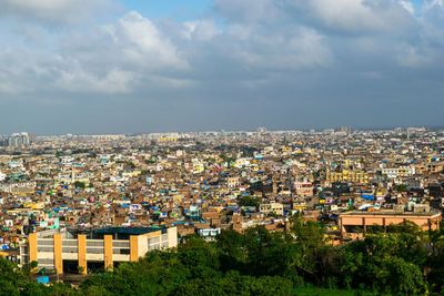 Aerial view of cityscape against sky