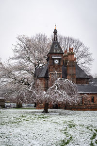 Traditional building against sky during winter