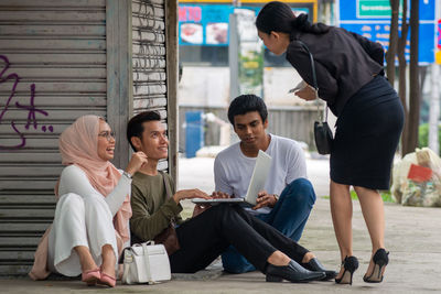 Group of people using mobile phone