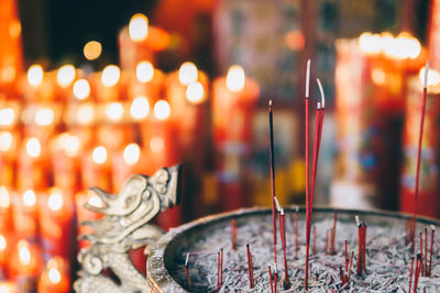 Close-up of incense sticks in temple