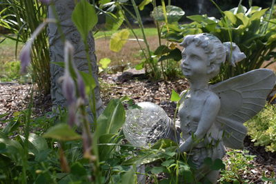 Close-up of statue on field