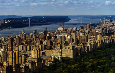 High angle view of city against cloudy sky